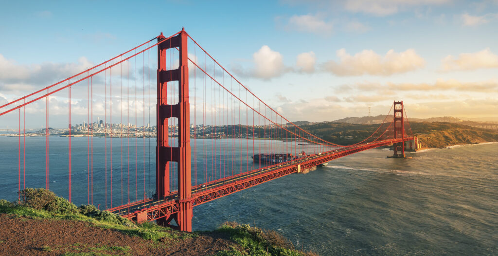 Cars driving on the Golden Gate Bridge in San Francisco, some potentially in need of a California Lemon Law Attorney.